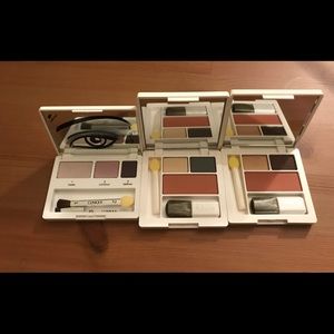Three Clinique eye/blush palettes